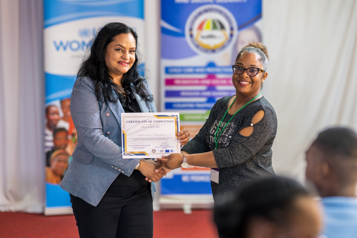 Picture of Hon. Dr Vindhya Persaud- Minister in the Ministry of Human Services and Social Security presents certificate of completion to participant