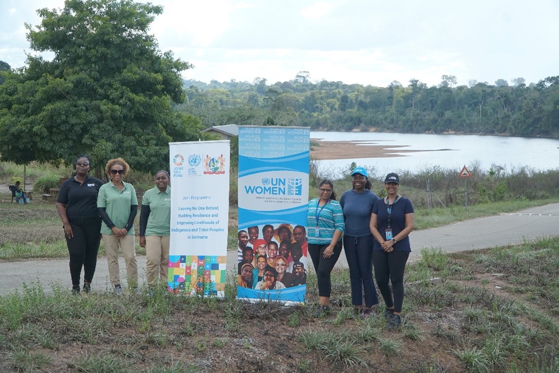 Part of the delegation are pictured here in front of the river in the tribal village of Atjoni