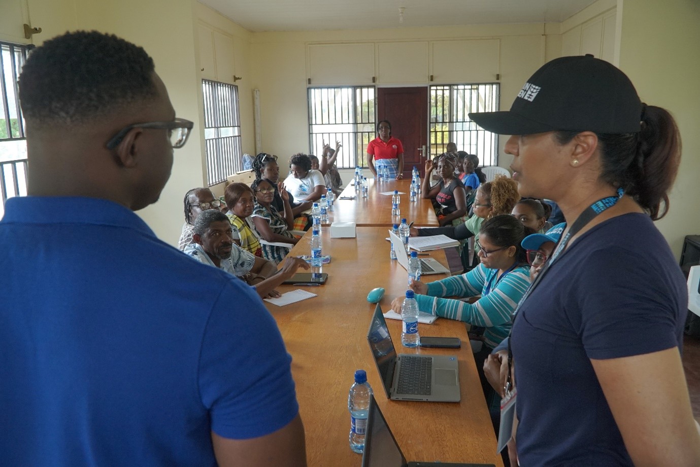 Picture of Je’nille Maraj, Planning Coordination Specialist at UN Women MCO Caribbean being aided by a translator to facilitate the focus group in Atjoni