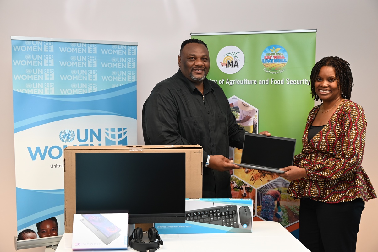 Presentation of ICT equipment from UN Women's Deputy Representative, Isiuwa Iyahen, to PS in the Ministry of Agriculture, Mr. Terry Bascombe