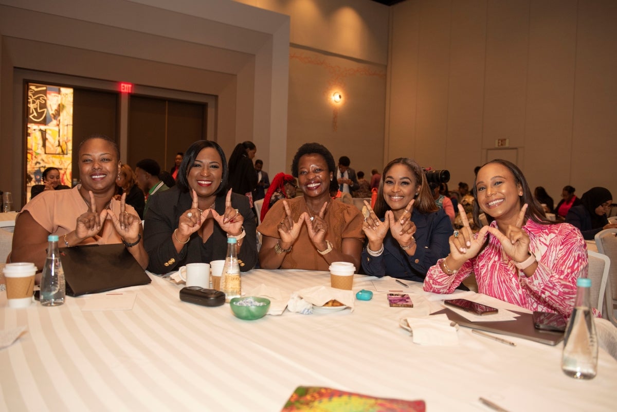 Attendants making the #PushForward symbol