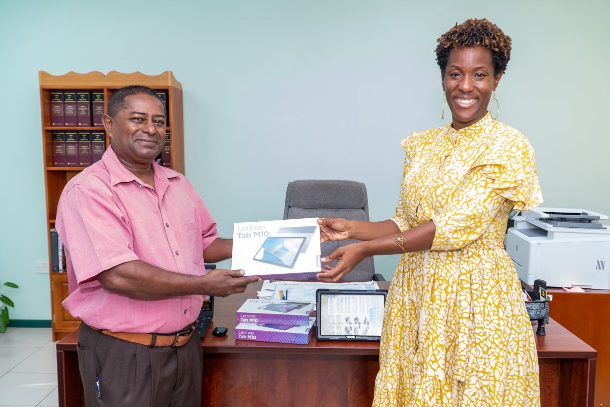 Rep Tonni Brodber making presentation to PS Isaac Bhagwan in Grenada Ministry of Agriculture