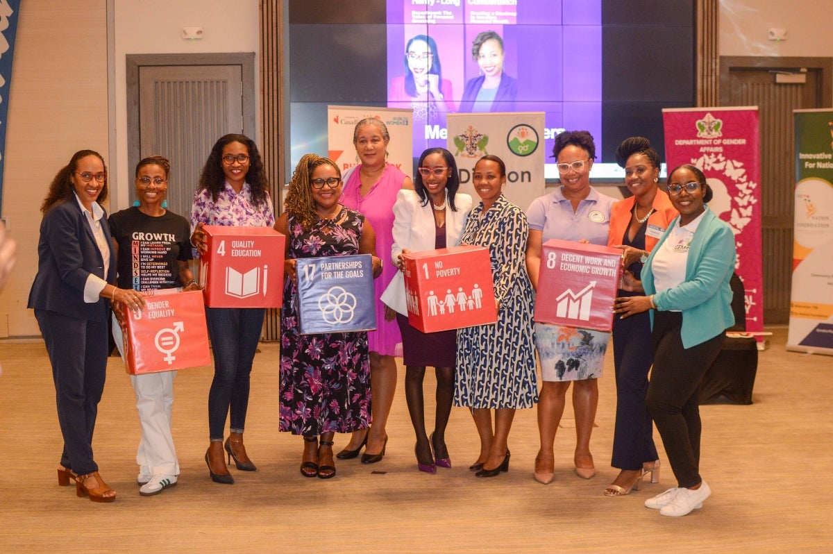 Participants at the IWD Mixer holding UN SDG boxes