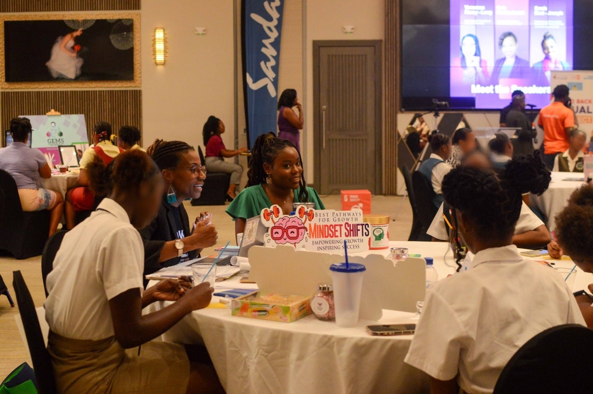 A group of attendees at the IWD Mixer engage in discussion