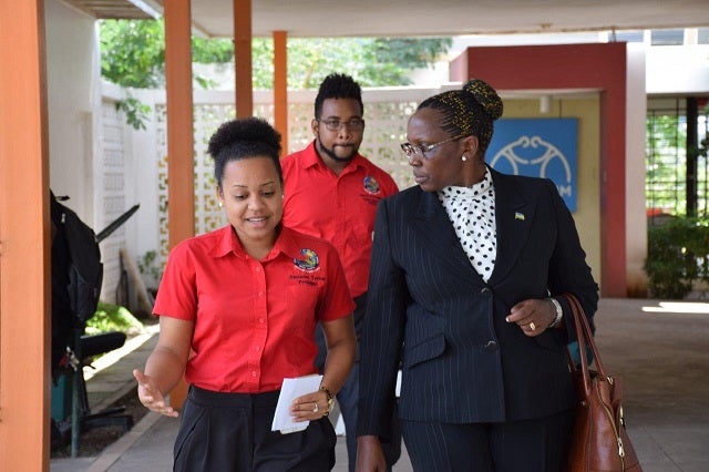 Rwanda Member of Parliament, the Honourable Juliana Kantengwa in the national dialogue with Coordinator of the UWI Leads ESJ Project Marlon Walcott