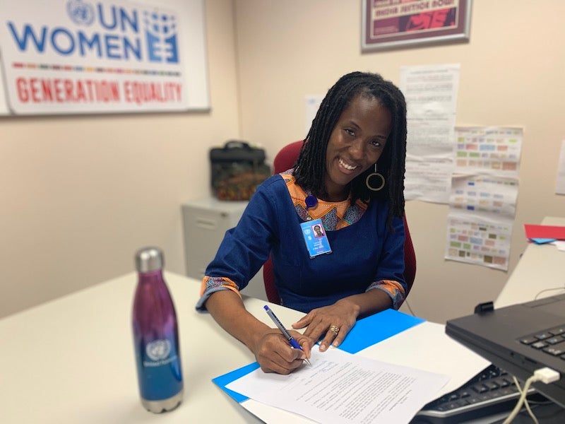 UN Women MCO Caribbean Representative a.i. Tonni Brodber signing the UDC/UN Women MOU during the virtual event.