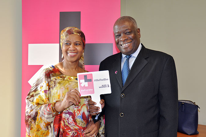 Executive Director Phumzile Mlambo-Ngcuka pins Chief Justice Marston Gibson to recognize him as a HeForShe. Photo: UN Women/Ricardo Leacock