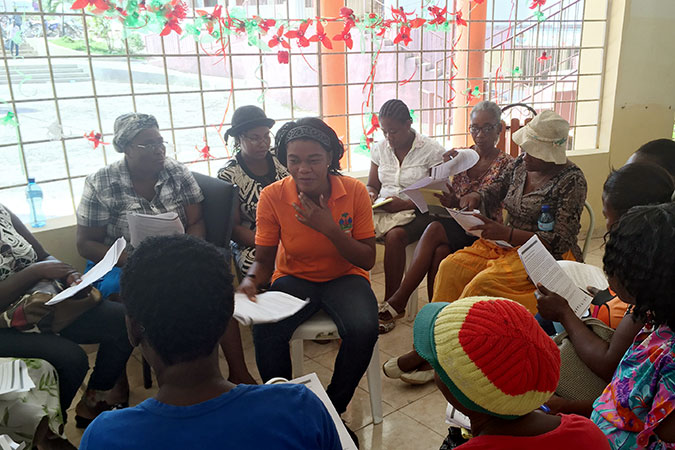 Women affected by  Hurricane Matthew in Haiti come together in safe and social women's spaces. Photo: UN Women/Maria Sanchez