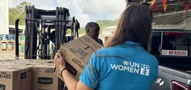 UN Women staff member offloads hurricane supplies