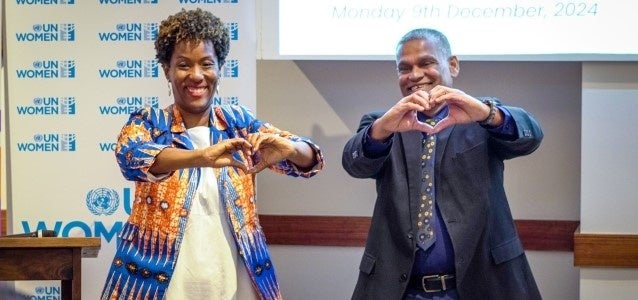 Tonni Brodber, Representative of UN Women MCO - Caribbean, and Vijay Gangapersad, Permanent Secretary of Gender and Child Affairs, doing the #PushForward challenge